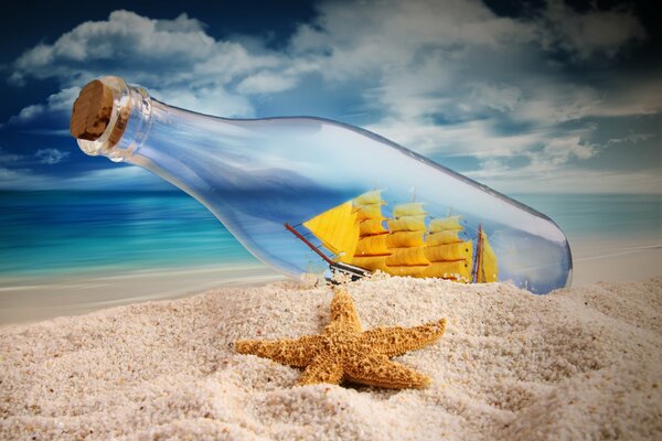 A ship with sails inside a bottle on the seashore