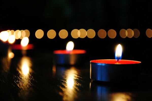 The bright flame of candles on the table