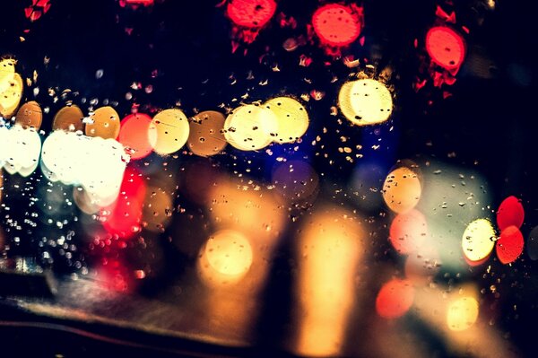 Divine lights of raindrops on the glass