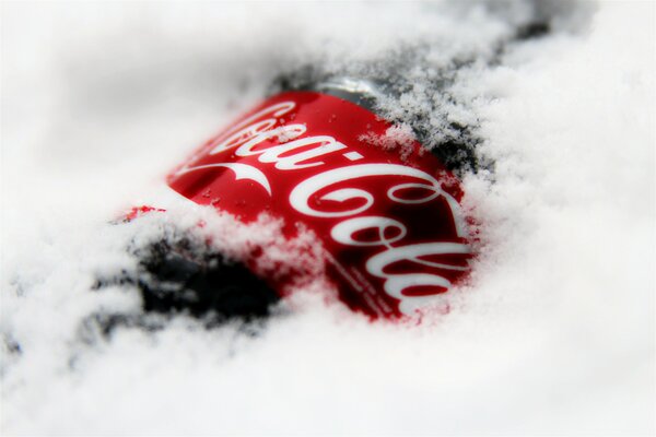 Coca Cola drink in the snow in winter