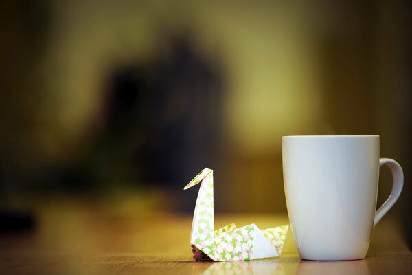 A paper crane and a cup of tea