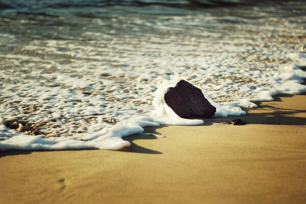 Foam from the Moscow surf on the beach