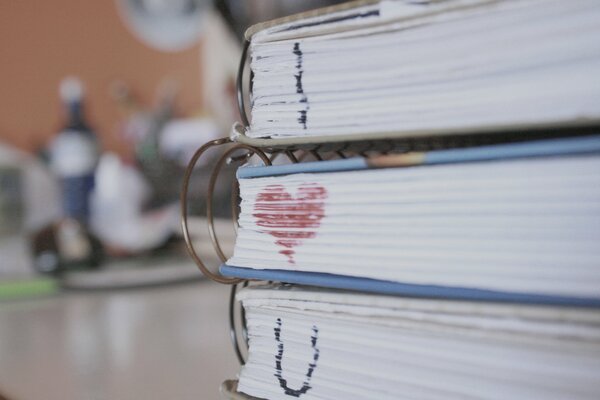 Macro image of book pages with a drawn heart