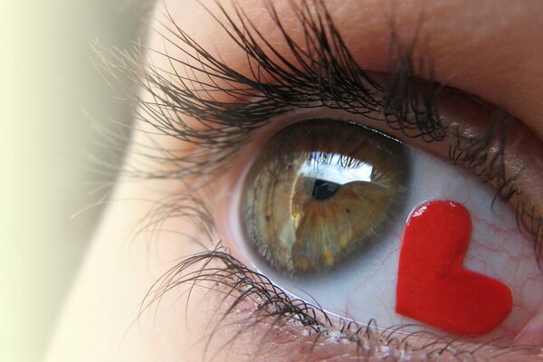 An eye with a red heart inside