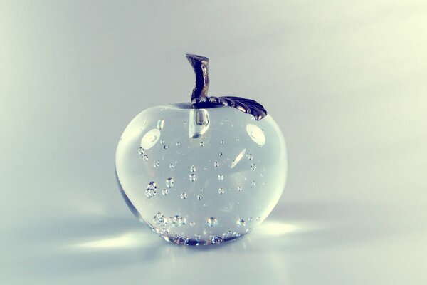 Glass transparent apple on a white background