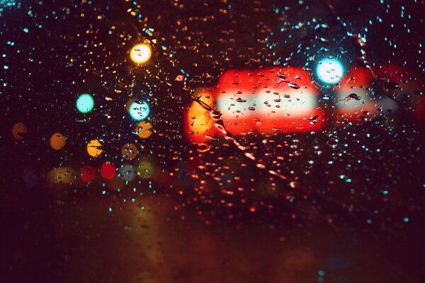 Raindrops and the glitter of the lights of the big city