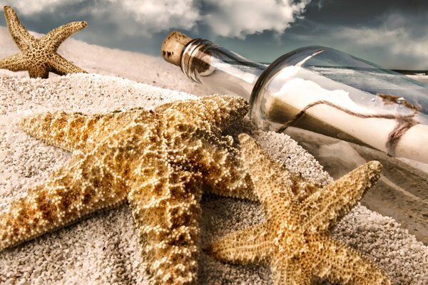 Sandy beach. A message in a bottle with a note