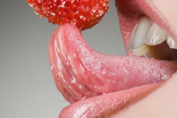 Juicy sugar strawberries on the tongue