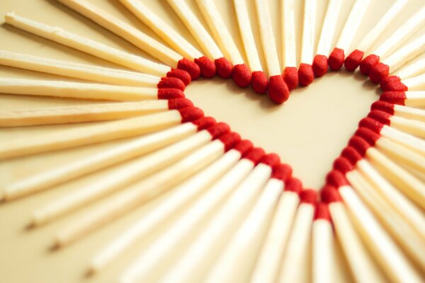 Matches laid out with a heart in focus