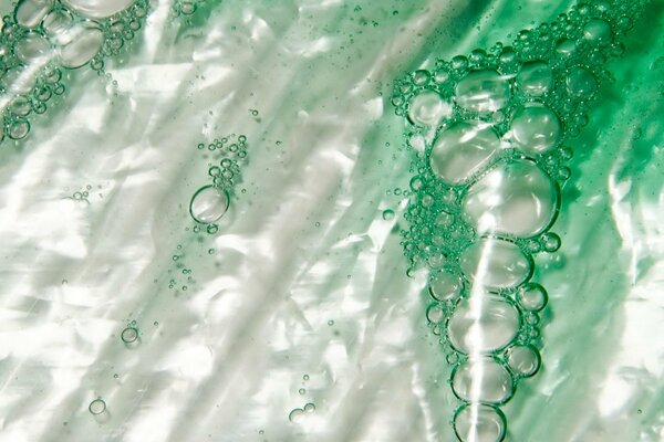 Bubbles of green liquid. Macro photography