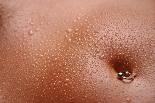 Drops of moisture on a tanned body
