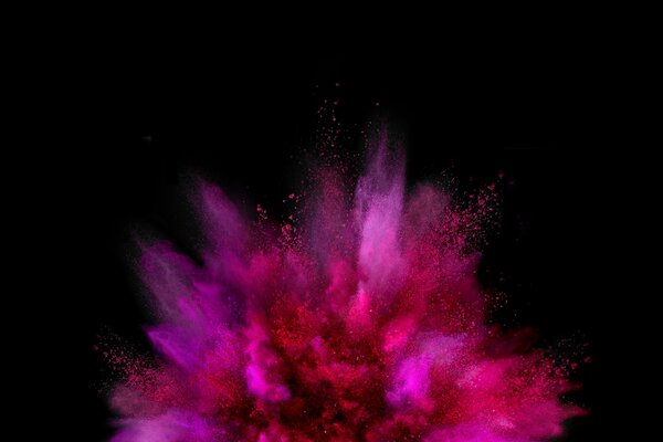 Explosion de peinture rose sur fond noir