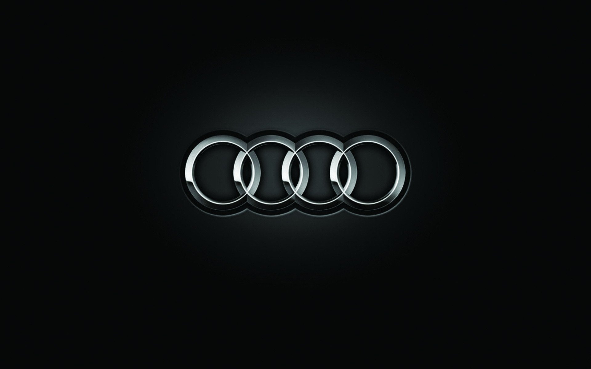 black background audi brand logo light