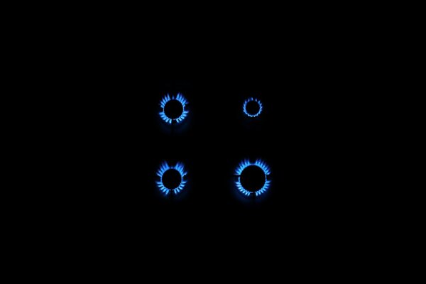 Background of a gas stove with a blue flame