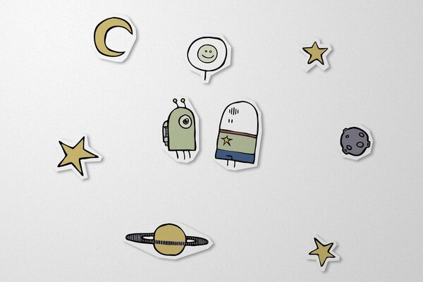 Freaks surrounded by planets, stars and the moon on paper