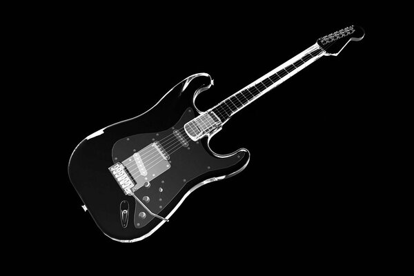 Elegante guitarra negra sobre fondo negro