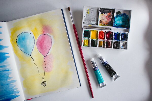 Drawing with blue and pink ball paints