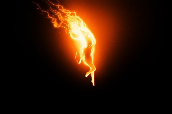 Burning silhouette of a girl on fire