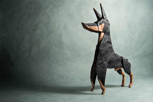 Origami paper in the form of a doberman