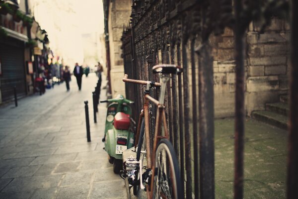 An old street with a wrought-iron fence