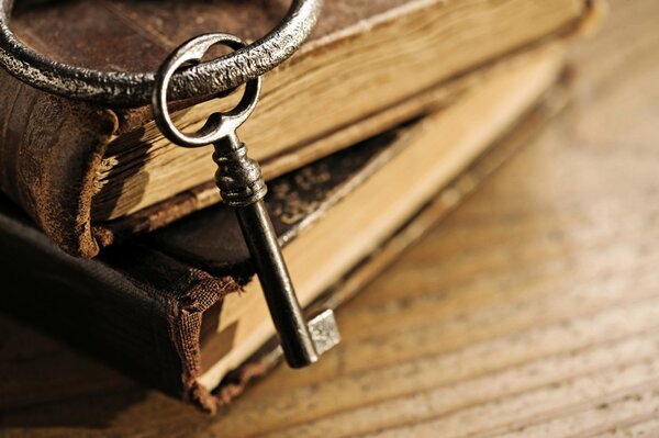 An old book with a key on the ring