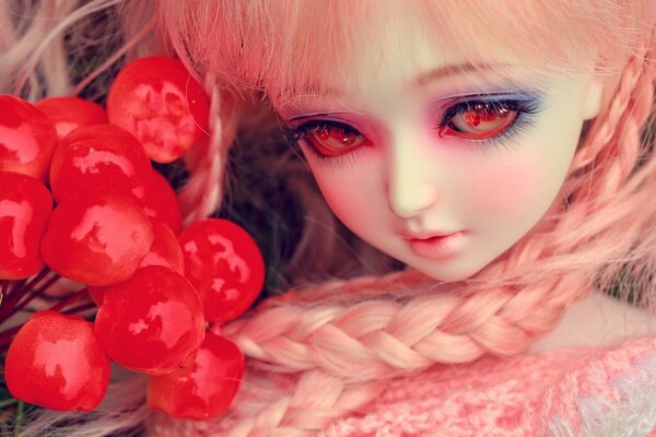 Toy doll with red berries
