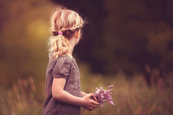 Photo of a girl with flowers in the middle of the forest