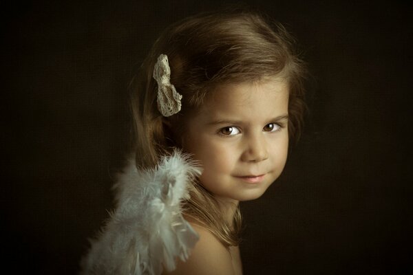 The Little Angels series. Portrait of a girl with dark hair