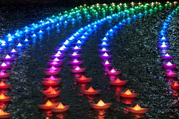 Image of multicolored glowing paper boats