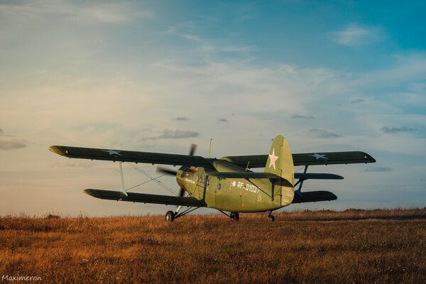 Photo of an airplane standing in a field