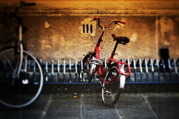 Red bicycle in the parking lot for small transport