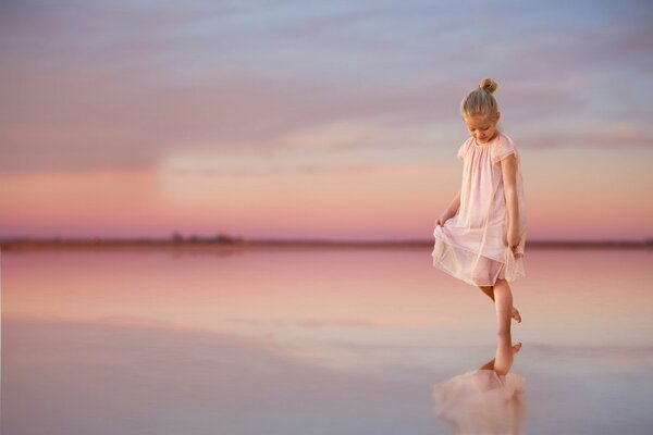 Girl in white reflection from the water