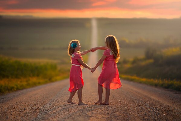 Cute girls dancing on the road