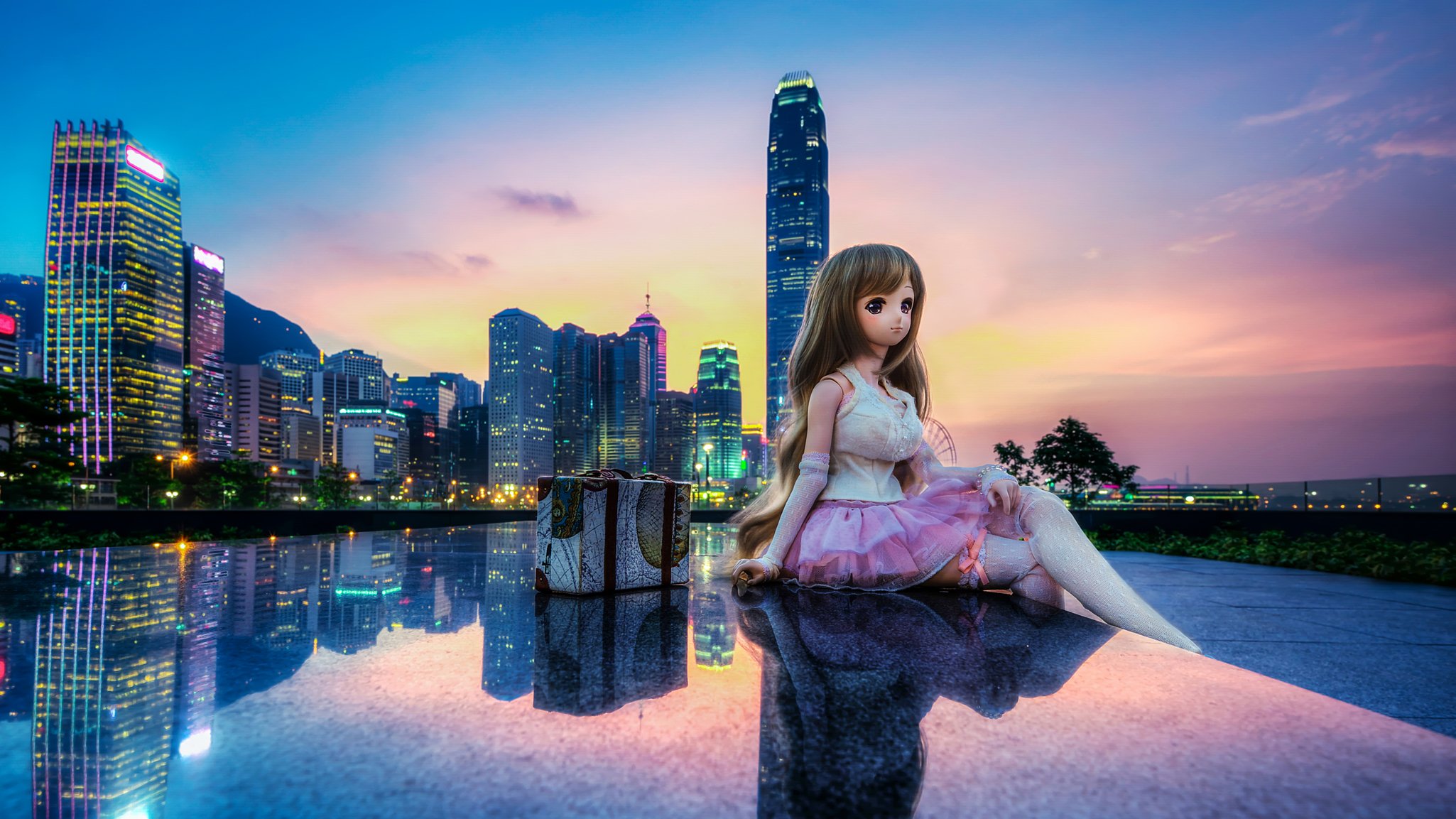 tamar park admiralty hong kong china town buildings toys doll reflection sunset