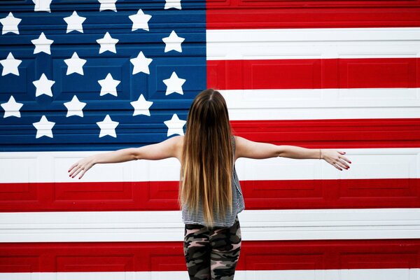 A girl with long hair on a flag background