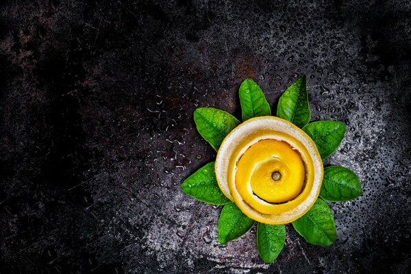 Homemade flower made from lemon peel and lime leaves