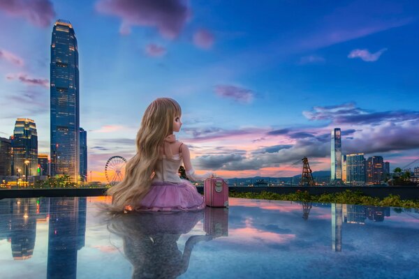 Beautiful doll on the background of a big city