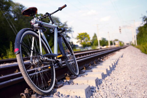 The bike is on the railway tracks