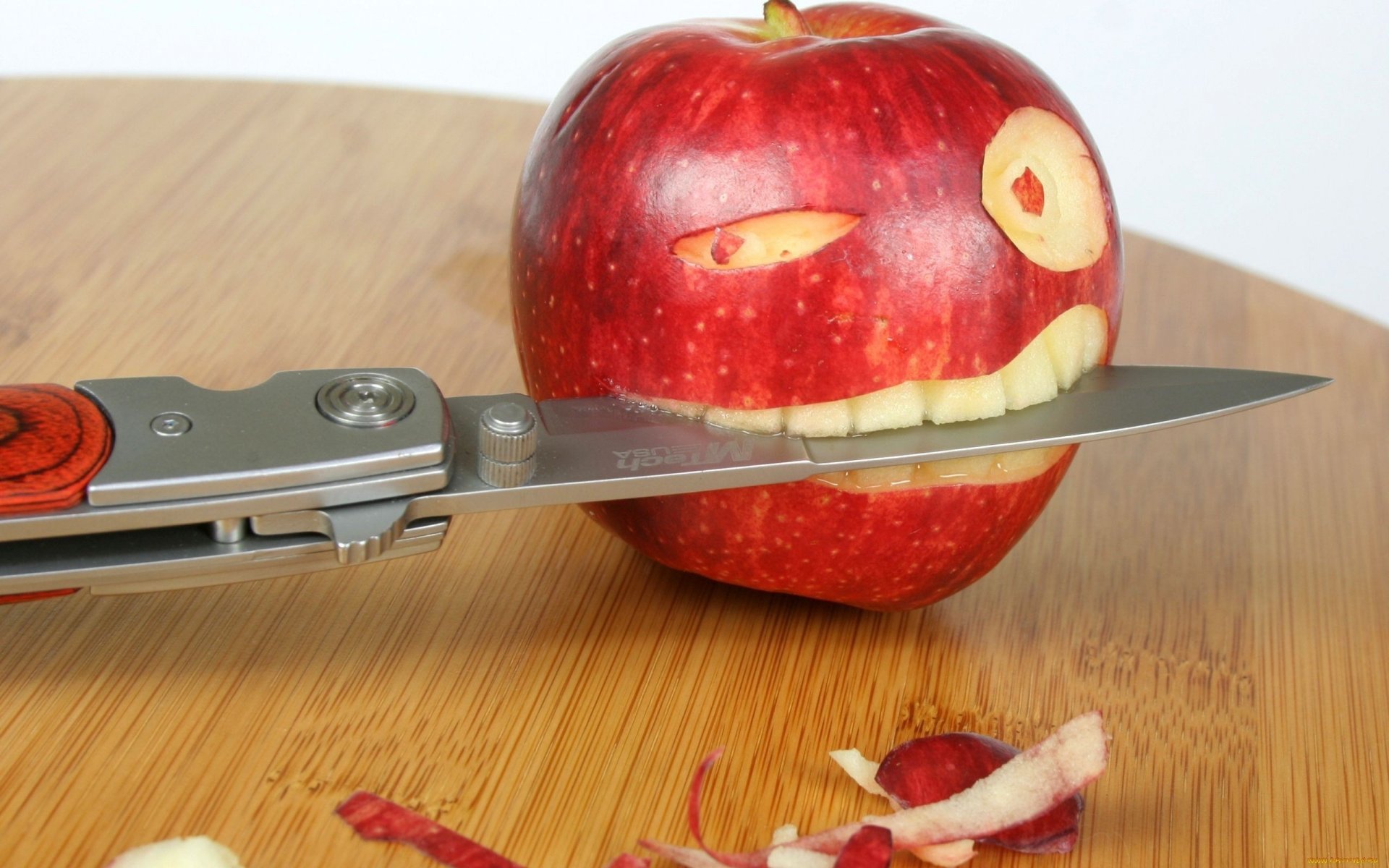 apple knife table teeth eye