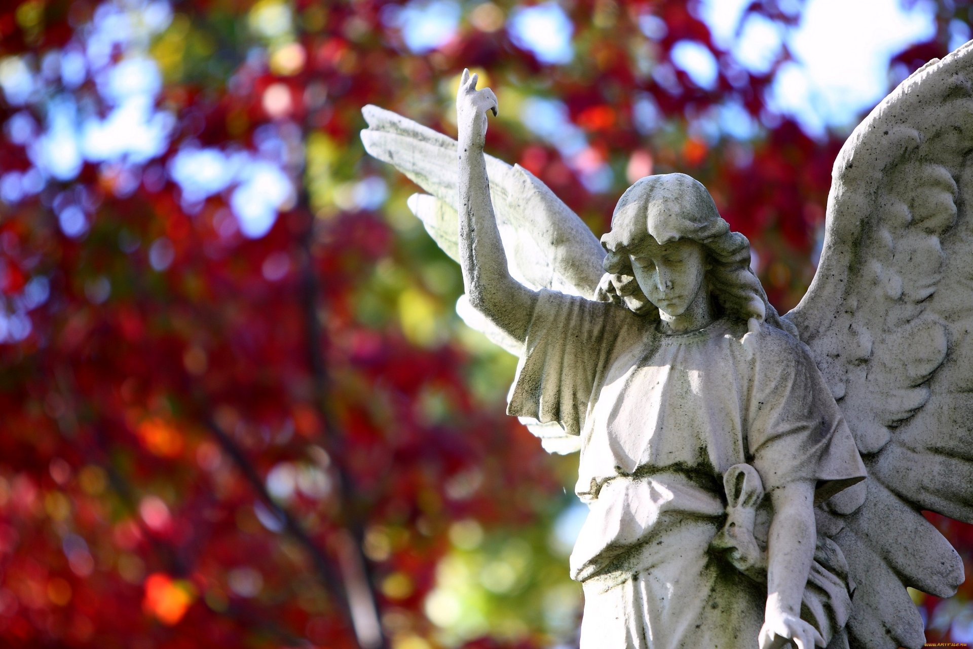 escultura ángel alas estatua