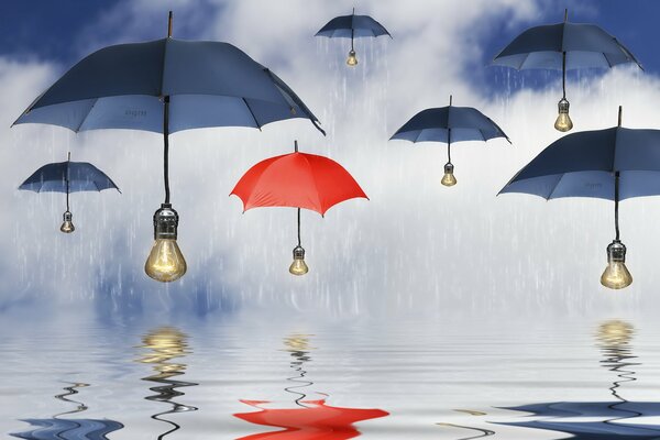 Umbrellas of blue and red colors with a light bulb instead of handles in the rain