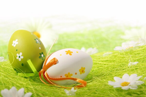 Painted eggs on an Easter green background