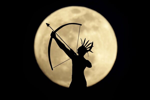 Archer sur fond noir avec la lune