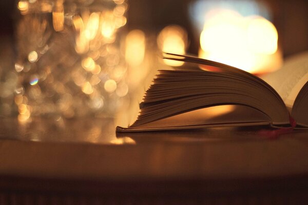 An open book on a table with a blurry background