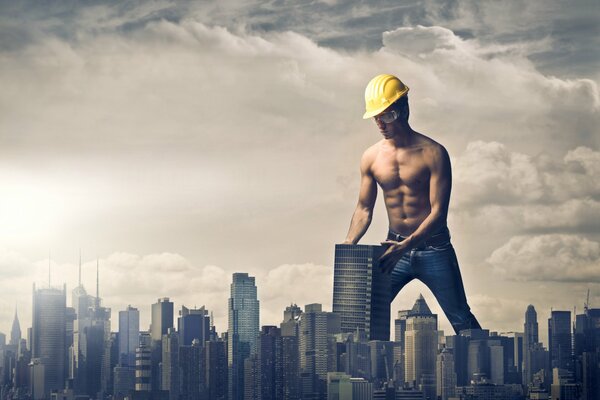 A man in a giant helmet builds a city under the clouds