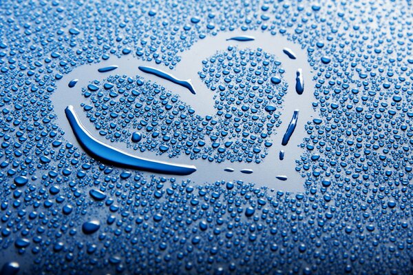 A heart made of water drops on a blue background