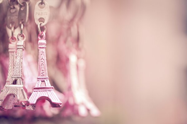 Pink Key chains with Eiffel Tower hanging next to each other