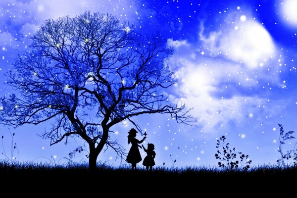 Silhouettes of children and a tree against the starry sky