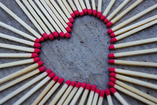 The red heart is lined with matches