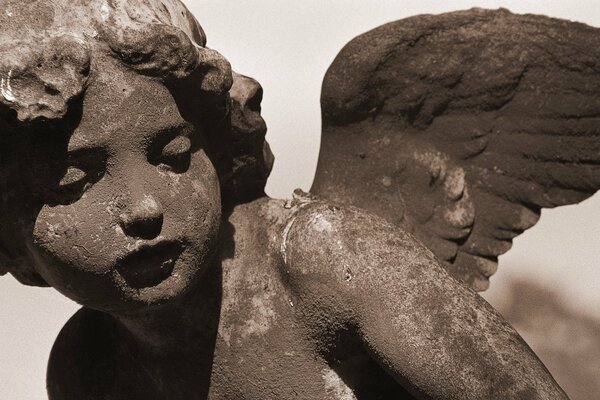 Sculpture of an angel - child made of stone